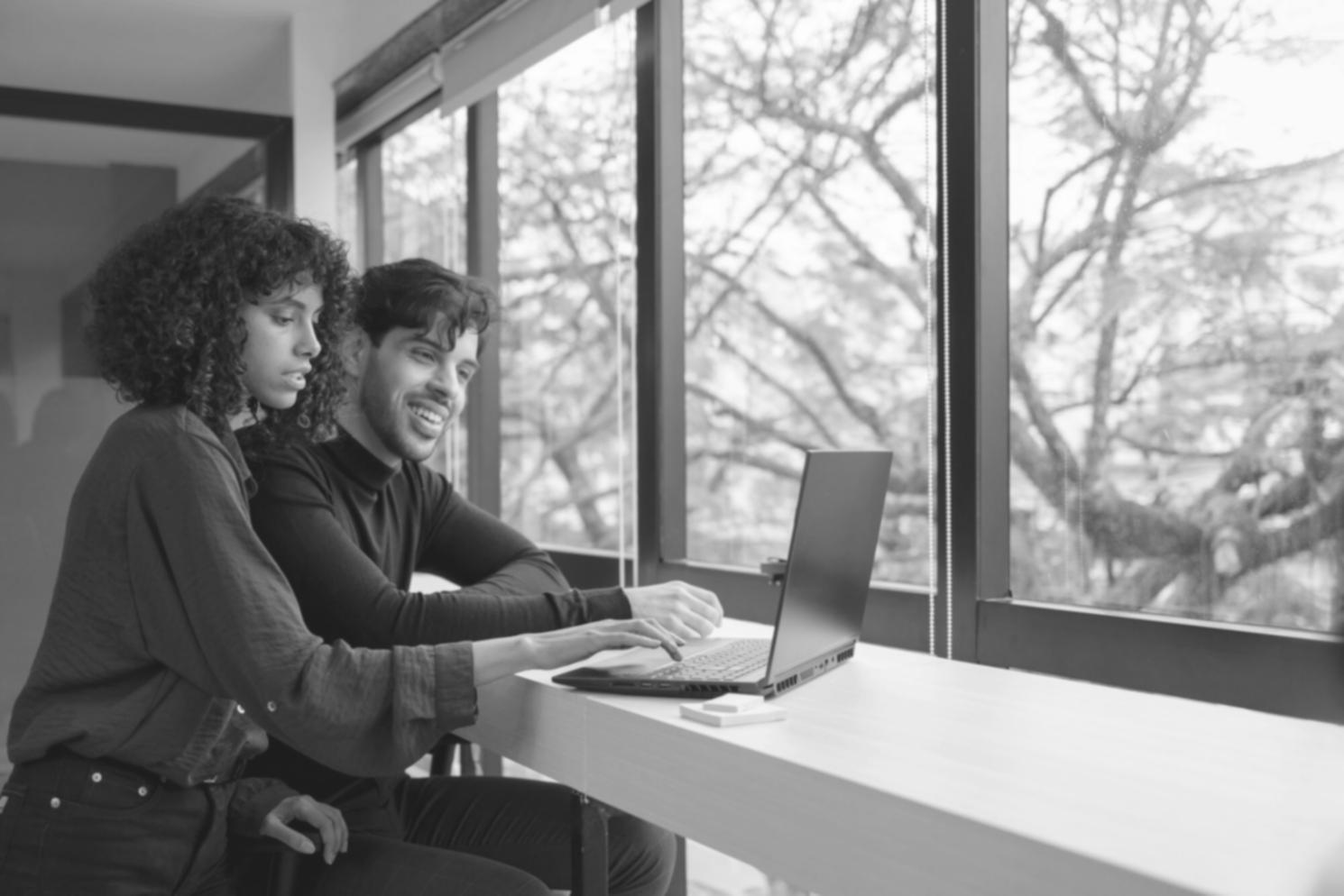 Professional working on financial documentation with modern computer setup